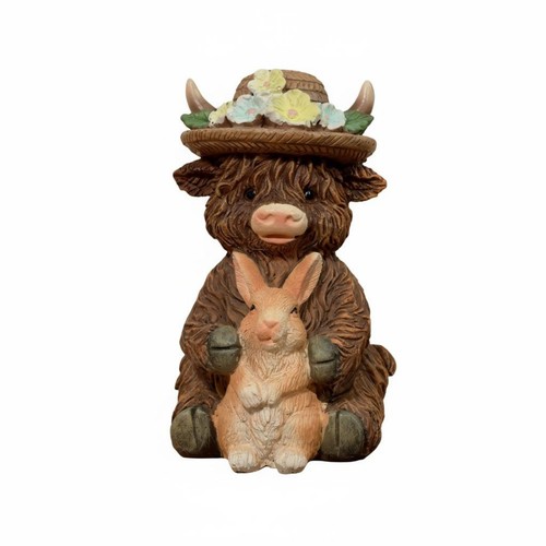 Highland cow holding rabbit - holding,